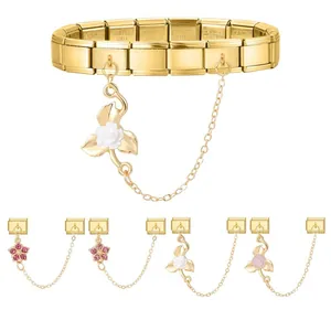 Detailed view of gold modular Italian charms with floral and crystal pendants