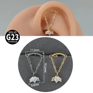 Detailed macro view of G23 titanium chain earring with flower pendant and dimensions
