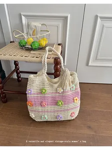 Handmade crochet tote bag with colorful flower patterns for summer beach vacations