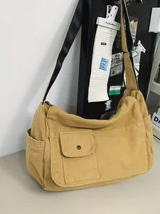Minimalist khaki canvas messenger bag with large capacity and adjustable crossbody strap