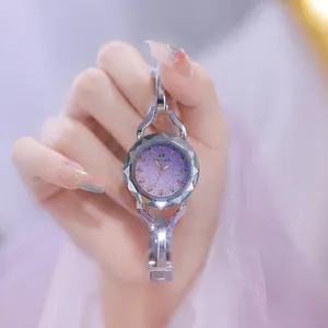 Elegant purple dial watch with silver bangle strap and rhinestone detail FA1565