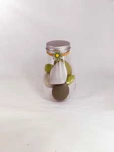 Detailed view of soft beauty sponges in a clear jar with a floral decorative lid.