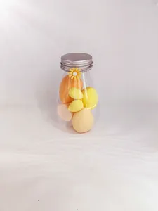 Professional soft makeup blender sponge set stored in a decorative clear drifting bottle jar.