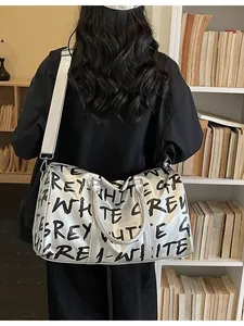 Silver large capacity travel gym bag featuring bold black graffiti letters design