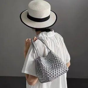 Stylish minimalist silver woven bucket bag with dual handles for women fashion use