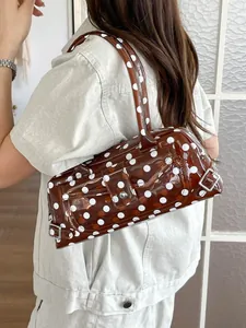 Stylish brown polka dot PVC baguette bag with adjustable shoulder strap