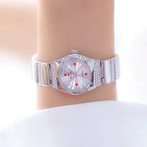 Elegante BS dameshorloge van zilver metaal met glinsterende strass-steentjes om pols