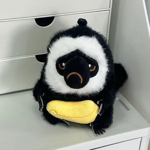 Llavero de peluche de mono saki de cara blanca con plátano para bolsos y coches