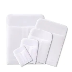 Set of five translucent vellum paper envelopes in various sizes for jewelry packaging.