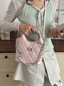 Stylish pink quilted bucket bag with silver chain detail and top handle for women