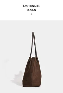 Detailed side view of a large vintage dark brown suede tote bag for daily commute