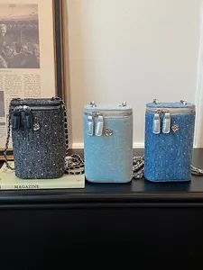 Elegant denim tweed mobile phone crossbody bag featuring chain strap and rhinestone accents