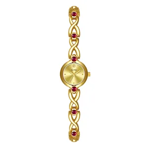 Elegante reloj dorado de estilo vintage francés con piedras rojas y correa decorativa