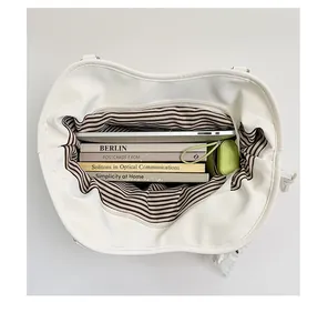 Close-up internal view of white tote bag showing large capacity with striped lining