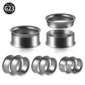 Detail of G23 titanium internally threaded double flare ear tunnels showing sizes