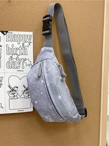 Casual gray star pattern waist bag hanging on a corkboard for sport fashion style