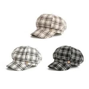 Elegant set of plaid tweed newsboy caps for women featuring a gold heart metal emblem