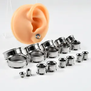 Professional G23 titanium internal thread double flare ear gauges shown with ear model