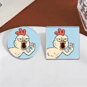 Detail view of round and square enamel pins featuring a funny shouting chicken