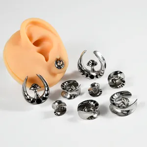 Stainless steel mushroom moon ear gauges and plugs piercing jewelry set with ear model.