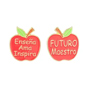 Set of red apple enamel pins featuring Spanish inspirational quotes for teacher appreciation