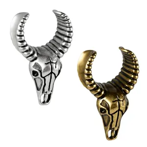 Pendants d'oreilles crâne de taureau vintage en argent et bronze pour piercings.