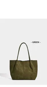 Detailed view of a vintage green suede large capacity tote bag for casual commuting
