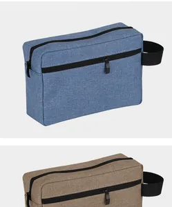 Macro view of waterproof Oxford cloth bags in blue and brown with zippers and handles.