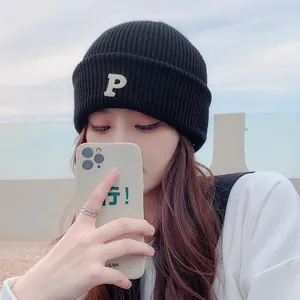 Premium black knitted beanie hat with white letter P embroidery for casual winter style