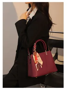 Elegant burgundy women handbag with silk scarf, stylish large capacity tote bag for daily wear.