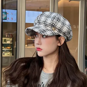 Elegant plaid newsboy cap for women, stylish winter baker boy hat in a classic cafe setting