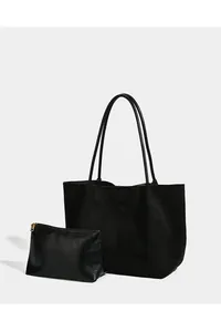 Detailed view of the black suede large tote bag with matching leather pouch set