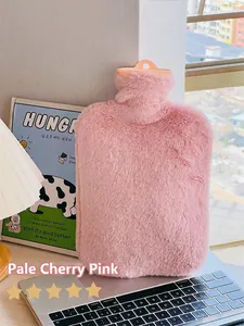 Macro shot of the soft pink faux rabbit fur cover on the winter hot water bottle