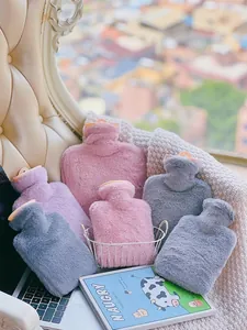 Cozy plush faux fur hot water bottles in soft pink, grey, and purple tones for winter.