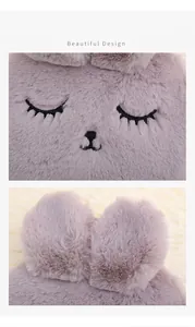 Detailed view of soft plush rabbit hot water bottle with embroidered sleeping face