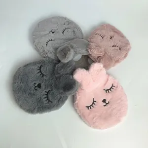 Close-up of fluffy plush rabbit-shaped hot water bottle covers in four soft colors
