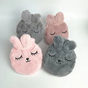 Close-up view of cute plush rabbit hot water bottle covers in pink and grey colors