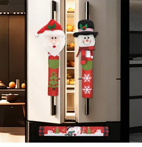 Christmas Santa and Snowman refrigerator handle covers shown on a kitchen fridge.