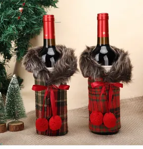 Detailed view of plaid Christmas wine bottle covers with faux fur trim and red bows.
