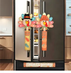 Close-up detail of festive Thanksgiving turkey handle covers for kitchen appliances