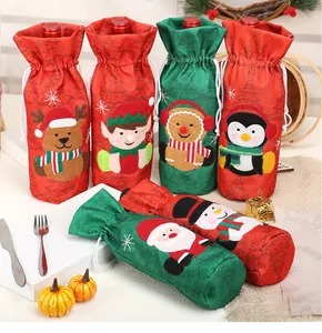 Detailed view of assorted Christmas wine bottle bags with festive character appliques