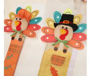 Detail showing plush turkey heads and burlap fabric of Thanksgiving handle covers.