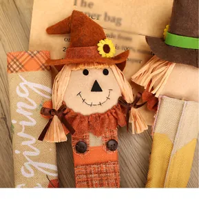 Detailed macro shot of a Thanksgiving scarecrow handle cover featuring burlap texture
