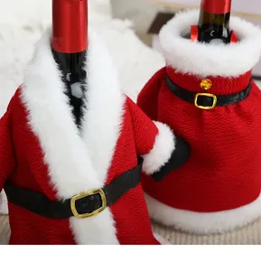 Detailed view of red Christmas wine bottle covers with white fur trim and belts