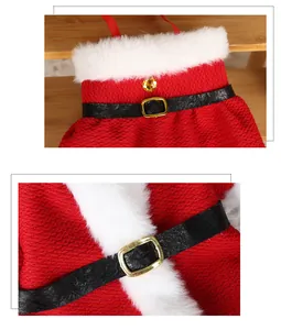Close-up of red Christmas wine bottle dress cover with white fur trim and golden buckle