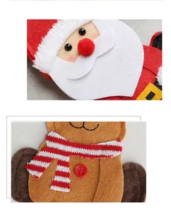 Vue macro de porte-couverts de Noël en feutrine Père Noël et Renne texturés
