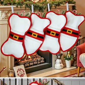 Detailed view of four bone-shaped Christmas stockings hanging on a festive mantel