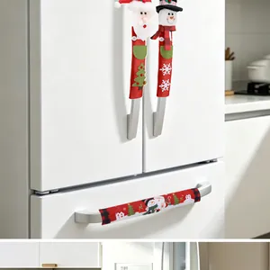 Detailed view of festive Christmas refrigerator handle covers with Santa and snowman designs.