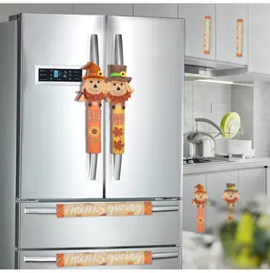 Scarecrow and Thanksgiving themed handle covers shown on a refrigerator in a kitchen