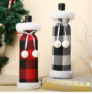 Close-up showing Christmas buffalo plaid wine bottle covers with white faux fur trim